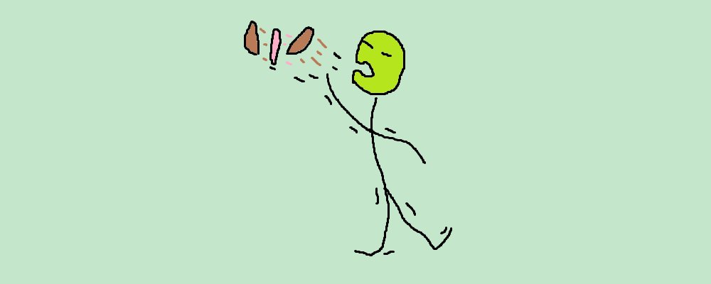 A person is tossing away a hamburger