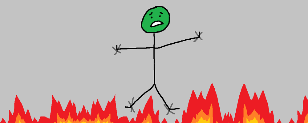 A character is tied to a wall, above flames